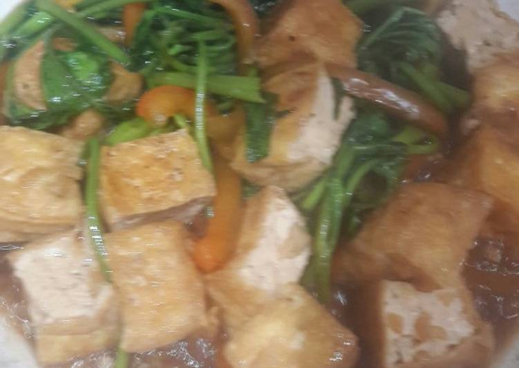 Stir fry Tofu and water spinach with oyster sauce