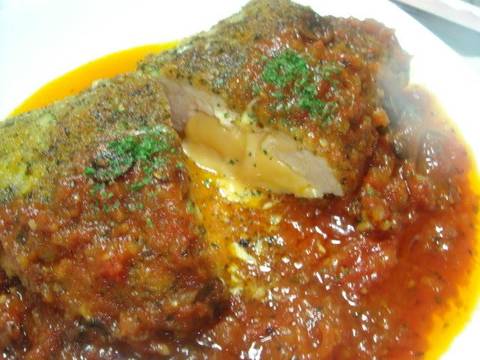 Breast breast tomato Served in Chicken  Breaded sauce Herb breaded in Tomato chicken Sauce