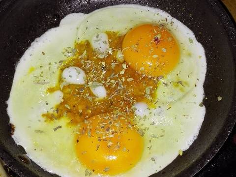 Photo from step 3 of the recipe Fried eggs in tomato and oregano mincemeat