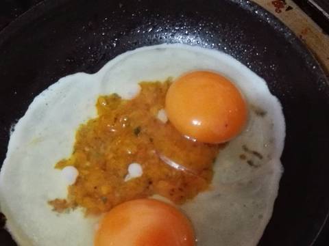 Photo from step 2 of the recipe Fried eggs in tomato and oregano mincemeat