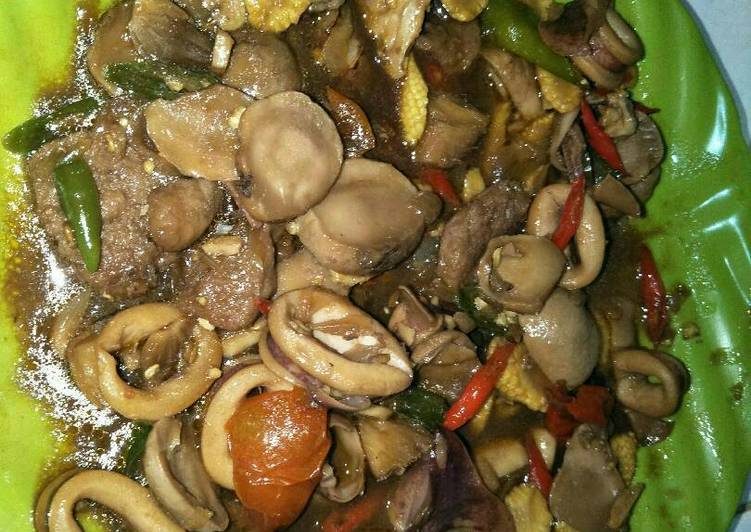 Resep Oseng cumi jamur kancing - Emy Rachmayati