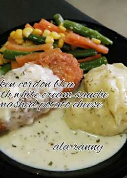 Chicken cordon bleu with mushed potato cheese and white cream sauce