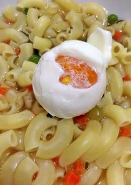 Italian macaroni soup with boiled egg