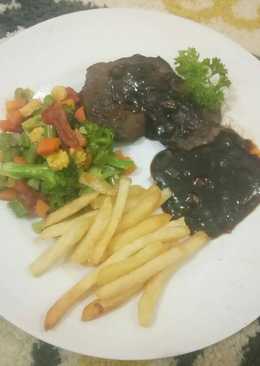 Beef steak with sauted honey vegetables and blackpeper sauce