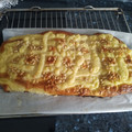 El cooksnap de juani Gernika cuando hizo Coca de Sant Joan 2024 v2: De crema, naranja confitada, almendras y piñones.