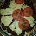 El cooksnap de cristina elizabeth cuando hizo Hamburguesa tipo pizza (con queso y tomate).