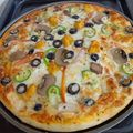 Umme Ahmad's cooksnap of when they made Chicken tikka pizza.