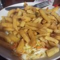 Mrs Otieno's cooksnap of when they made Chips served with chopped cabbage and chopped onions.
