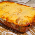 El cooksnap de Andrea cuando hizo Canelones de acelga, queso y ricotta con salsa bolognesa y bechamel. Gratinados 🍷🍽️.