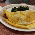 El cooksnap de Emilio García cuando hizo Omelette relleno de champiñones y queso con espinacas.