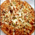Nosheen Nadeem's cooksnap of when they made Chicken tikka pizza.
