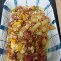 El cooksnap de Ana Isabel G C cuando hizo Patatas con beicon, jamón york, salchichas y huevos rotos con queso y gratinado.