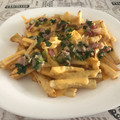 El cooksnap de Ale Espejo cuando hizo Papas fritas con salsa de cheddar, panceta y cebolla de verdeo.