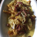El cooksnap de Andrea cuando hizo Papas fritas con salsa de cheddar, panceta y cebolla de verdeo.