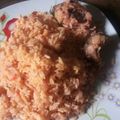 lois's cooksnap of when they made Jollof rice with fried chicken and cucumber.