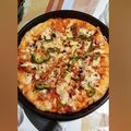 Hajra Fahad's cooksnap of when they made Chicken tikka pizza.