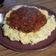 El cooksnap de Laura cuando hizo Polenta pigmentada con Vegetales y queso. Salsa con salchichas.