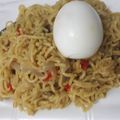 Ronny's cooksnap of when they made Curry noddles with carrots and boiled egg.