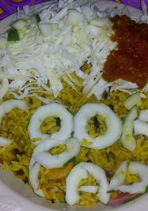 A picture of Fried rice, cabbage n tarugu sauce.