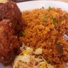 Jollof rice and peppered chicken A picture of Jollof rice and peppered chicken.