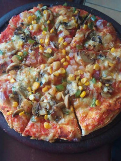 A picture of Fresh veggies and cheesy pizza#veganContest.