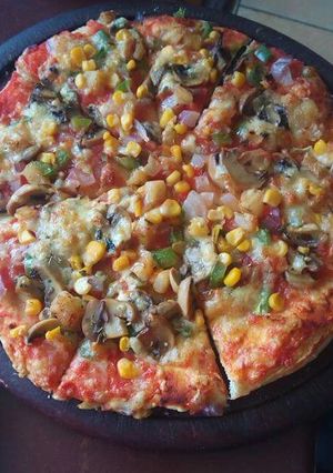 A picture of Fresh veggies and cheesy pizza#veganContest.
