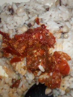 A picture of Rice and beans with awara sauce.