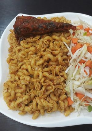 A picture of Macroni with coleslaw and titus fish.
