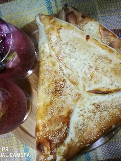 A picture of Cheese Fatayer with strawberries mocktail.