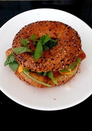 A picture of #Breakfast#Brunch#LunchMy Sausage Onion & Cheese Slice Bagel.