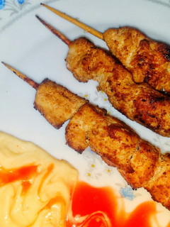 A picture of Orange Chicken skewers.