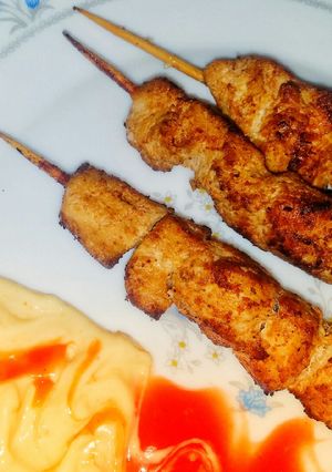 A picture of Orange Chicken skewers.