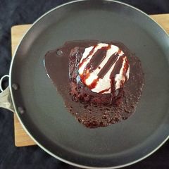 A picture of Sizzling Chocolate Brownie With Venila Ice cream.