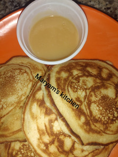 A picture of Pancakes and dulce de leche.