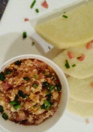 A picture of Boiled yam with egg sauce.