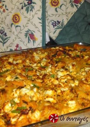 A picture of Spaghetti with shrimps in the oven.