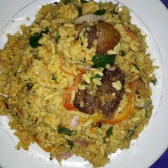 Jollof vegetable rice with fried meat A picture of Jollof vegetable rice with fried meat.