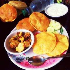 A picture of Besan messi masala puri - eat with arbi Fry.