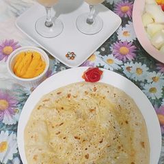 Daal bhari roti with mango lassi A picture of Daal bhari roti with mango lassi.