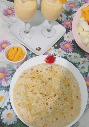 A picture of Daal bhari roti with mango lassi.