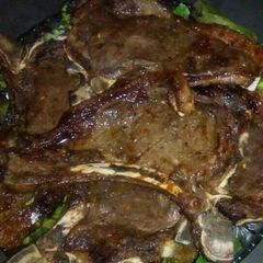 A picture of Grilled T bone steak.