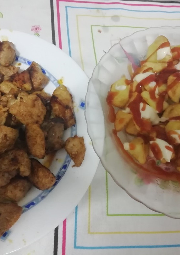 Una foto de Carne de cerdo y patatas fritas