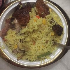 A picture of Seafood fried rice with grilled chicken.