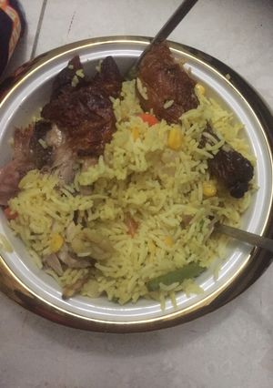 A picture of Seafood fried rice with grilled chicken.
