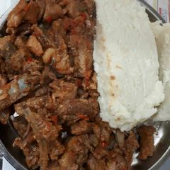 A picture of Fried pork with ugali.