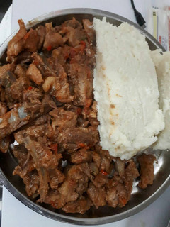 A picture of Fried pork with ugali.