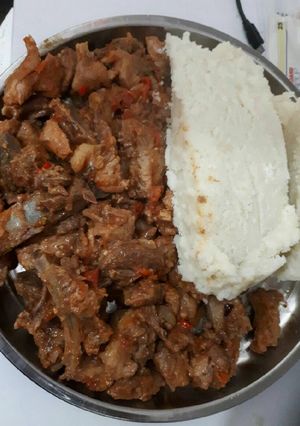 A picture of Fried pork with ugali.