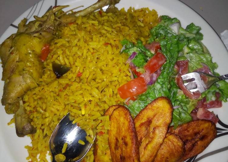 Jellof rice chicken with salad and plantain