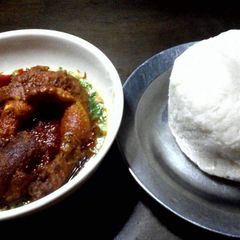 A picture of Okro with buka stew and poundo.