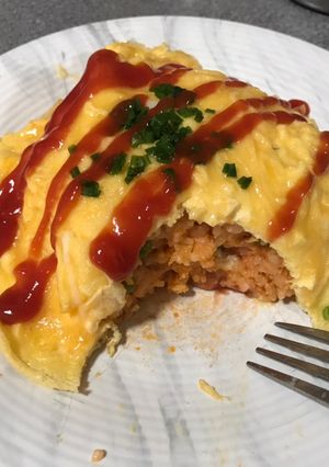 A picture of Tomato ketchup fried rice with omelette (kid’s omurice).